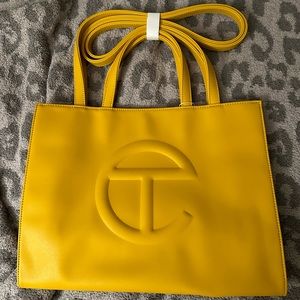 Telfar medium shopping bag in mustard